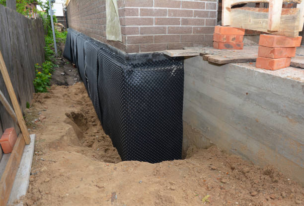 Happy homeowners after waterproofing job in Grover Hill